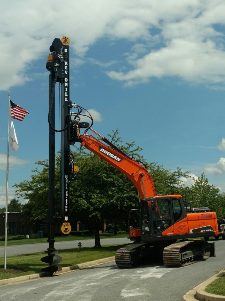 REV Drill next to American Flag at HQ in Frederick MD