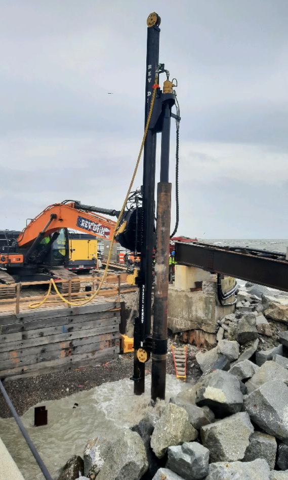 REV Drill digging into micro pile
