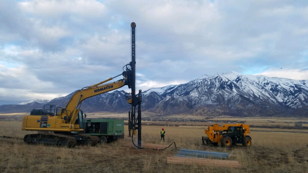 a rev drill being used to lay out the groundwork for a telecom company
